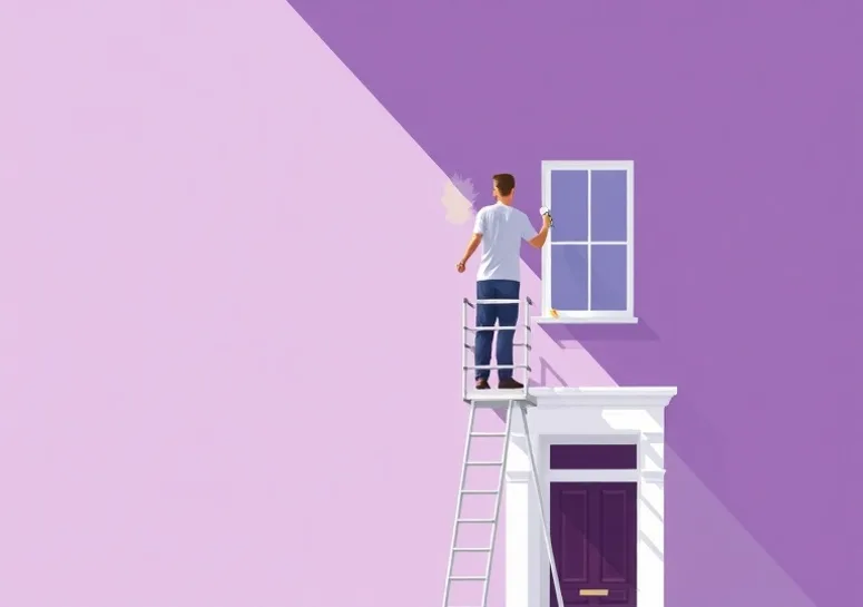 Peintre sur échafaudage traitant la façade d'une maison